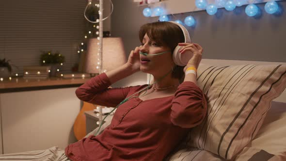 Girl Enjoying Music in Hospital Room