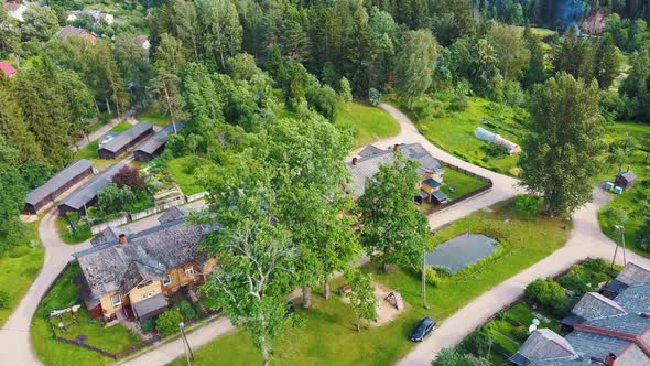 Old Wooden Houses Built for Paper Mill Workers in Ligatne. Wooden Row House 4K Aerial Shot	