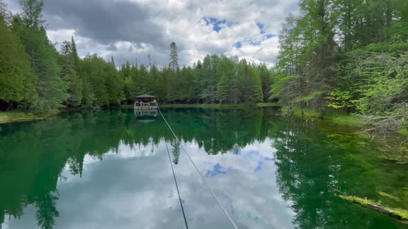 Lake Kitch-iti-kipi Michigan Beautiful Clear Water Small Lake on Cloudy Bright Day With Trees Nature