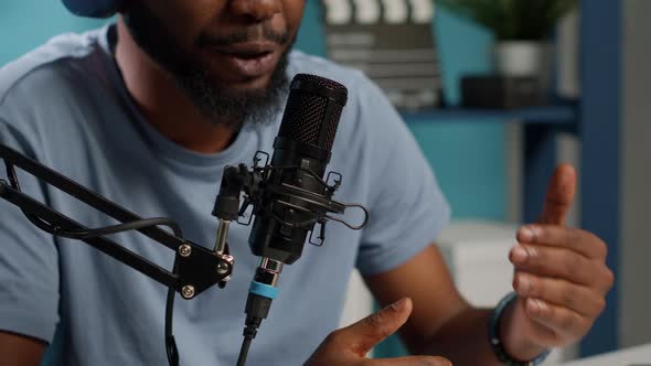 Close Up of Influencer Using Microphone to Talk on Online Podcast