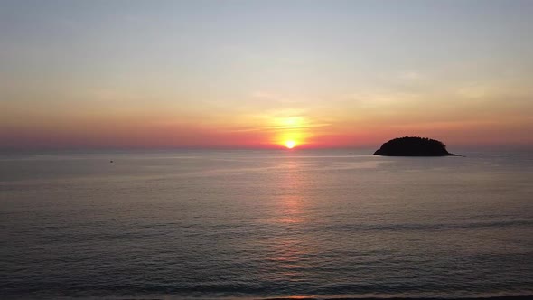 Aerial Sunset Over a Tropical Sea and Small Island