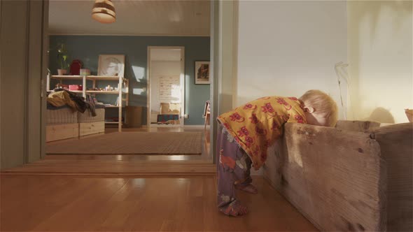 FAMILY LIFE - A cute 9 month old baby reaching into an old wooden box