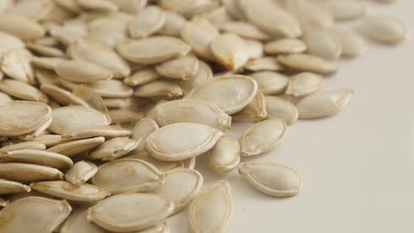 Organic pumpkin seed called pepita slow tilting video