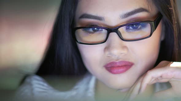 Portrait of Smiling Korean Employee Wearing Glasses Working on Laptop Looking at Screen