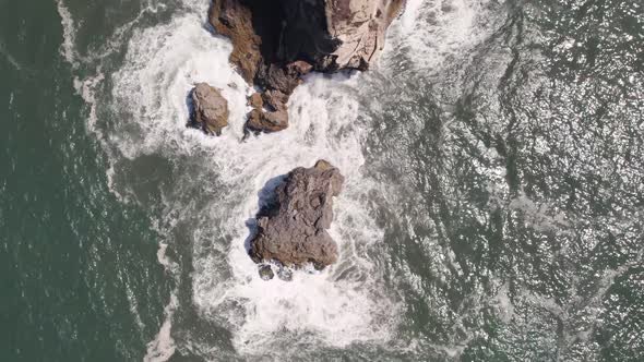 Vertical top down view of clifftop old Saint Michael the Archangel fort and Nazare lighthouse.