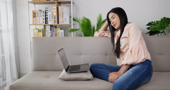 Woman  watching and sitting on couch