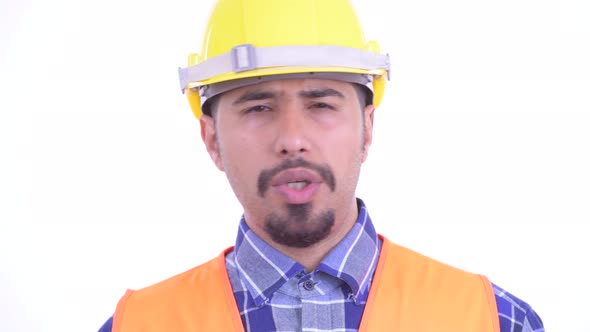 Face of Serious Bearded Persian Man Construction Worker Nodding Head No