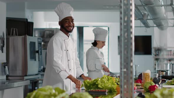 Authentic Portrait of African American Cook Preparing Food Dish