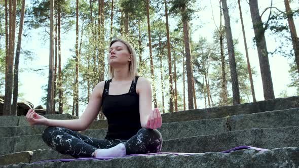 Girl meditation on a summer day