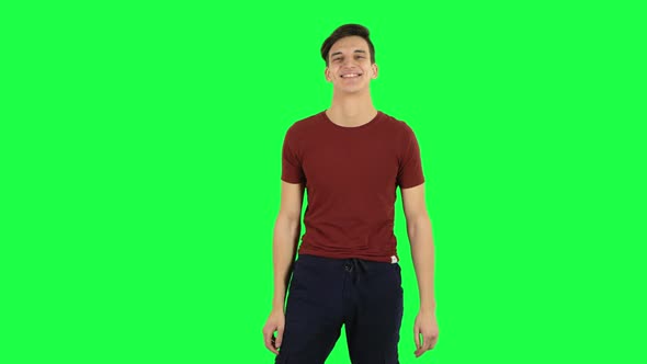 Guy Smiling While Looking at Camera and Flirting. Green Screen