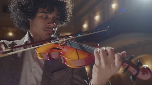 African American Musician Playing Fiddle on Stage