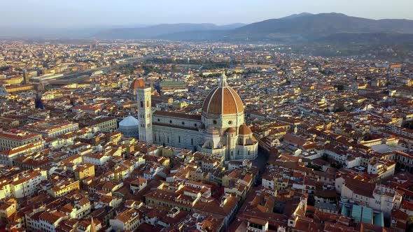 Duomo Cathedral of St. Mary of Fiore and St. John's baptistery on Florence Italy, Aerial circle pan