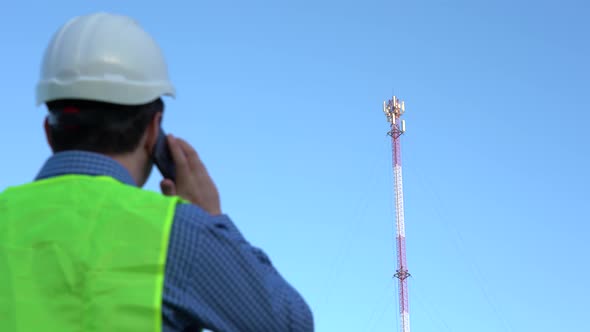 Cellular Engineer Next to the Mast