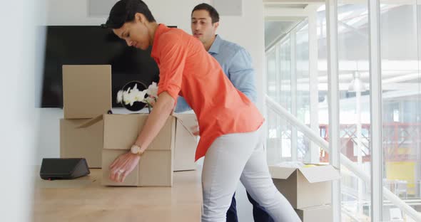 Young man and woman working in a creative office