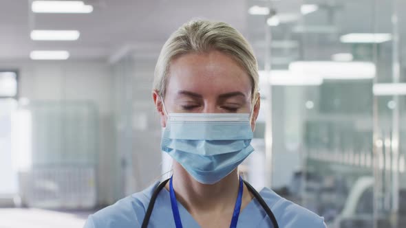 Portrait of female doctor wearing face mask in hospital