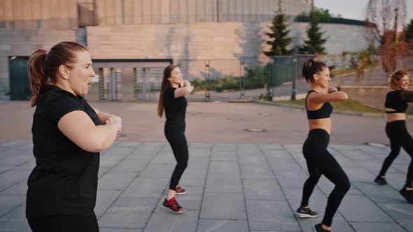 Girls of Different Ages and Complexions Dance Zumba