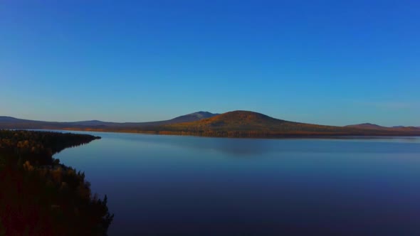 Aerial Video of Beautiful Mountain Lake on a Frosty Autumn Morning.