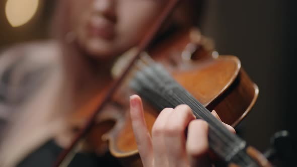 Young Female Student Violinist is Practicing Play Violin Closeup of Old Fiddle in Hands of Woman