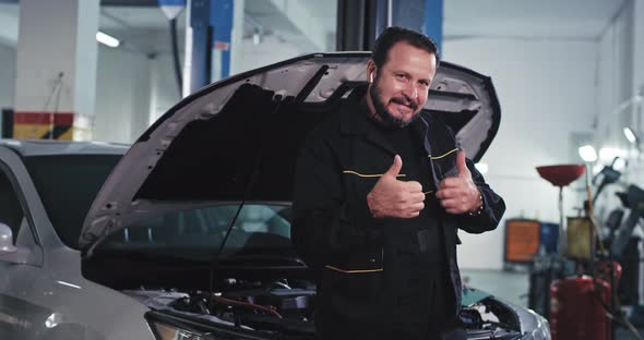 Smiling Mature Mechanic Man in Front of the Camera