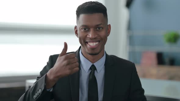 Portrait of African Businessman showing Thumbs Up Sign