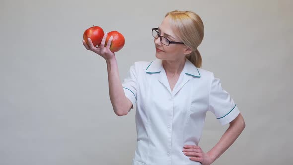 Nutritionist Doctor Healthy Lifestyle Concept - Holding Organic Red Apple