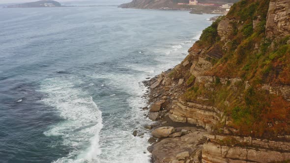 Aerial View of the Picturesque High Coastline Sharp Cliffs and Raging Sea