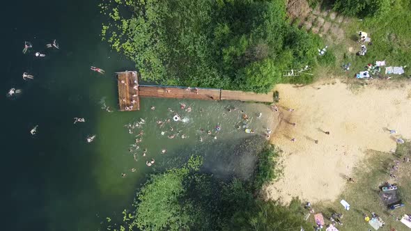 Drone Video of People Swimming in the Lake