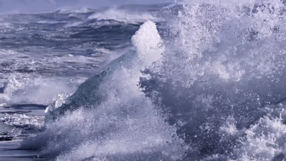 Ice From a Glacier Washing By Atlantic Ocean Waves on a Black Diamond Beach in Iceland. Climate