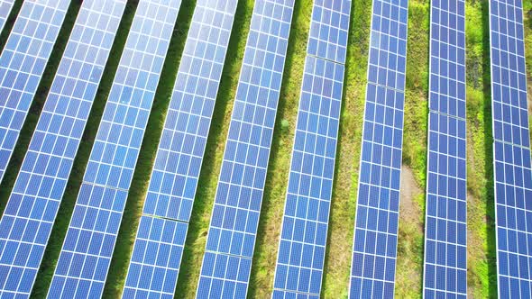 Drone fly over solar farm, renewable energy from solar.