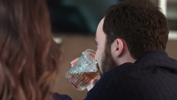 Cute Couple Talking and Having a Drink in a Bar