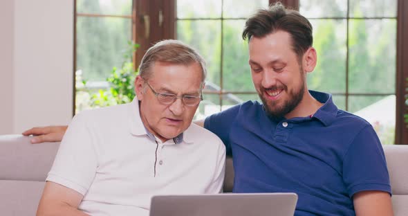 A Man Teaches His Father How to Do Online Shopping