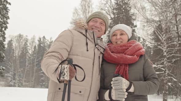 Couple in Park on Snowy Day alt