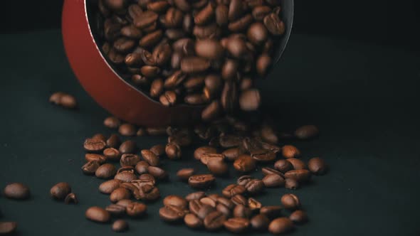 Coffee Beans are Hung Out of the Red Cezve in Slow Mo