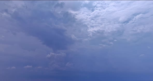 Panoramic View of Cumulus Clouds Floating on the Horizon Full of Sunlight