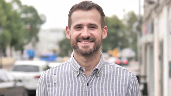 Outdoor Portrait of Smiling Beard Casual Man