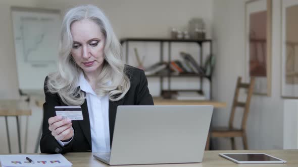 Online Shopping By Middle Aged Businesswoman