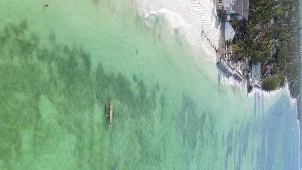 Vertical Video of the Ocean Near the Coast of Zanzibar Tanzania Aerial View