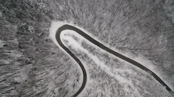Top view of a winter curvy mountain road