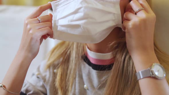 Traveler Wearing Face Mask While Traveling on Commercial Airplane