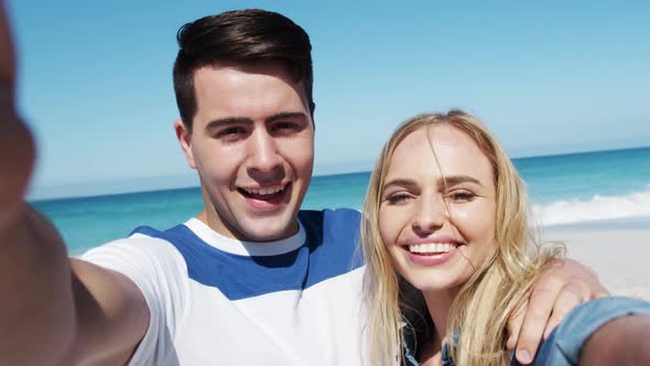 Couple in love enjoying free time on the beach together