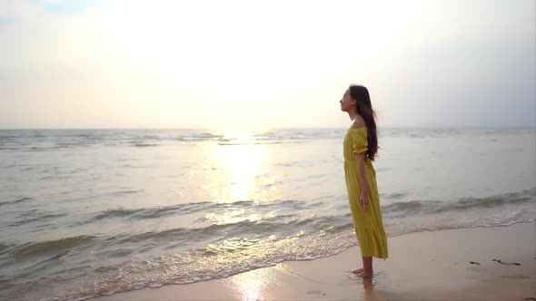 Asian woman enjoy around beautiful beach sea ocean