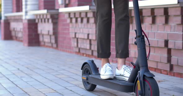 Nodern Woman On Electric Scooter