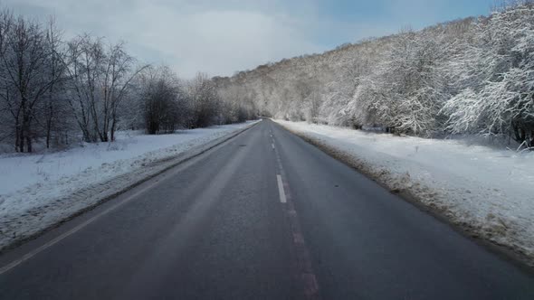 Aerial View of Plateau LagoNaki Mountain Twisted Road in the Winter and Driving Car