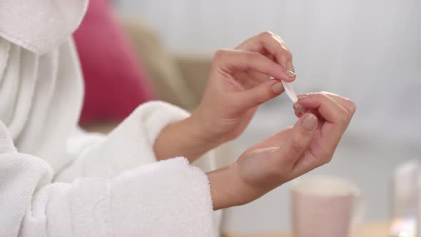 Unrecognizable Woman Filing Nails