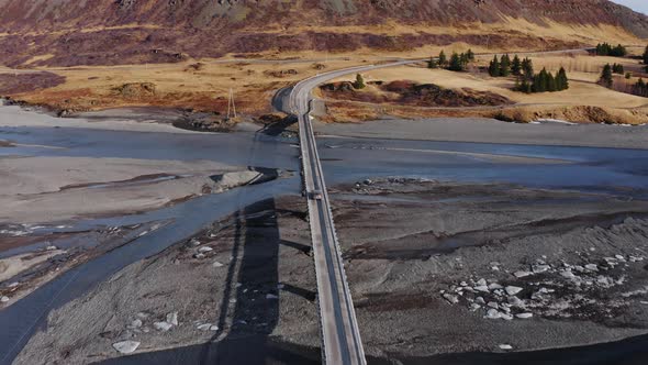 Drone Following Car Crossing Bridge Over Hvannagil Estuary