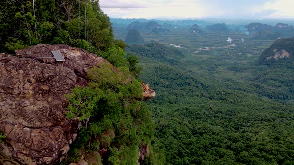 Dragon Crest Mountain Krabi Thailand a Young Traveler Sits on a Rock That Overhangs the Abyss with a