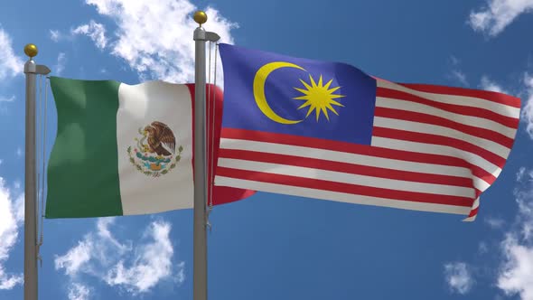 Mexico Flag Vs Malaysia Flag On Flagpole