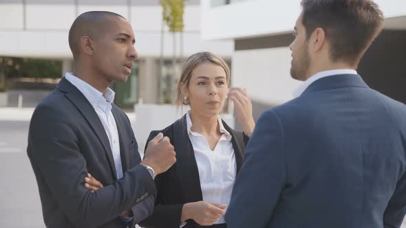 Professional Young Business People Discussing Work Outdoor