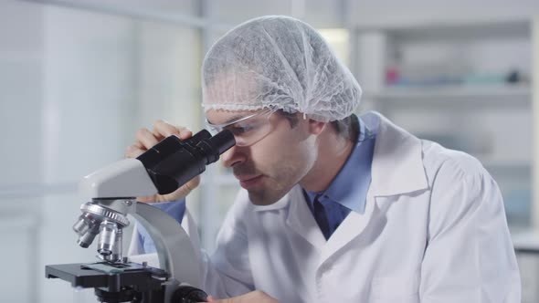 Microbiologists Working in Lab