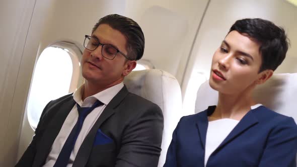 Passengers Stretching for Muscle Relax in Airplane